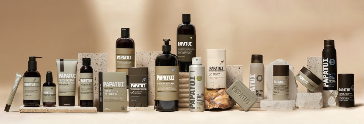 Collection of Papatui skincare and hair care products on a beige background