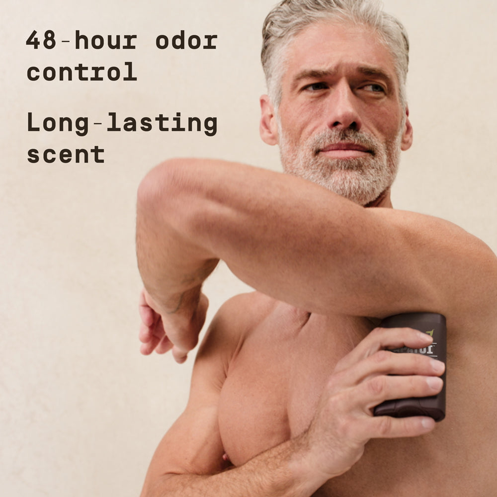 Man applying Papatui Antiperspirant Deodorant against a neutral background with text overlay reading "48-hour odor control Long lasting scent"