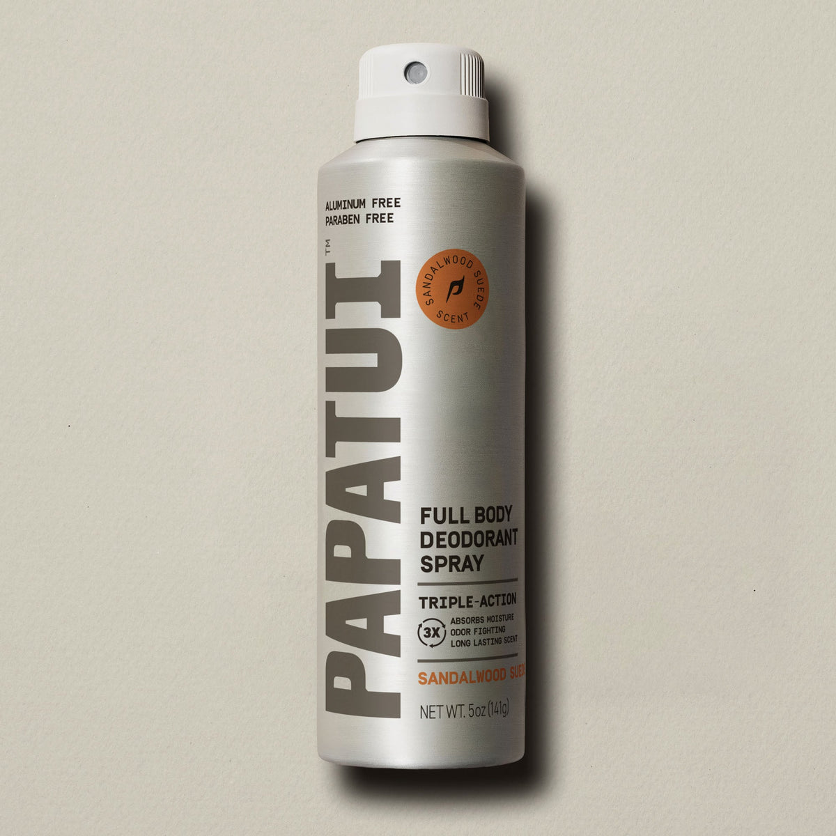 PAPATUI Sandalwood Suede full body deodorant spray can on a beige background