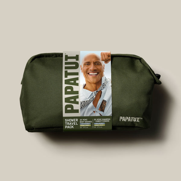 Papatui holiday gift set shower travel pack dopp kit includes a green bathroom bag with Dwayne "The Rock" Johnson on the cover with lush coconut and cedar sport body wash and shampoo and conditioner.