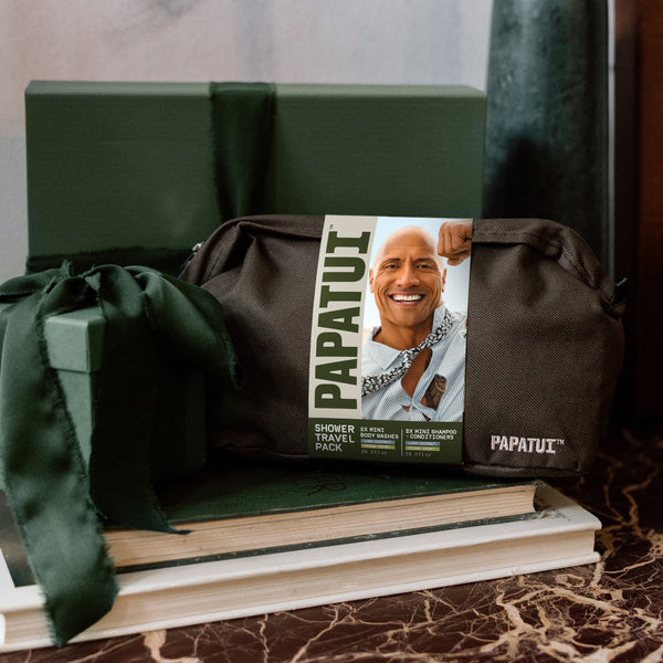 This image shows the Papatui Shower Travel Pack dopp kit with other gifts to promote giftable men's care for the holidays.