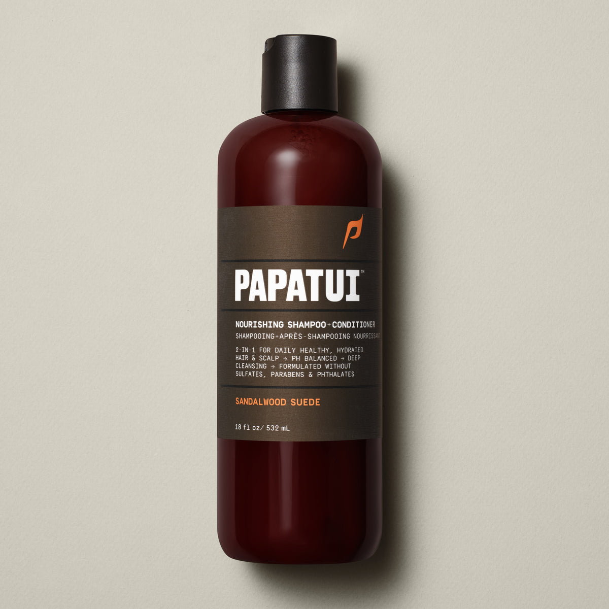 Papatui Sandalwood Suede Nourishing Men's 2-in-1 Shampoo + Conditioner shampoo bottle on a neutral background