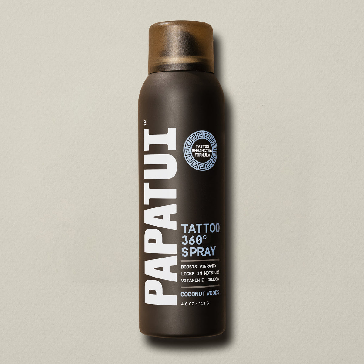 Brown PAPATUI Tattoo 360 Spray bottle on a beige background