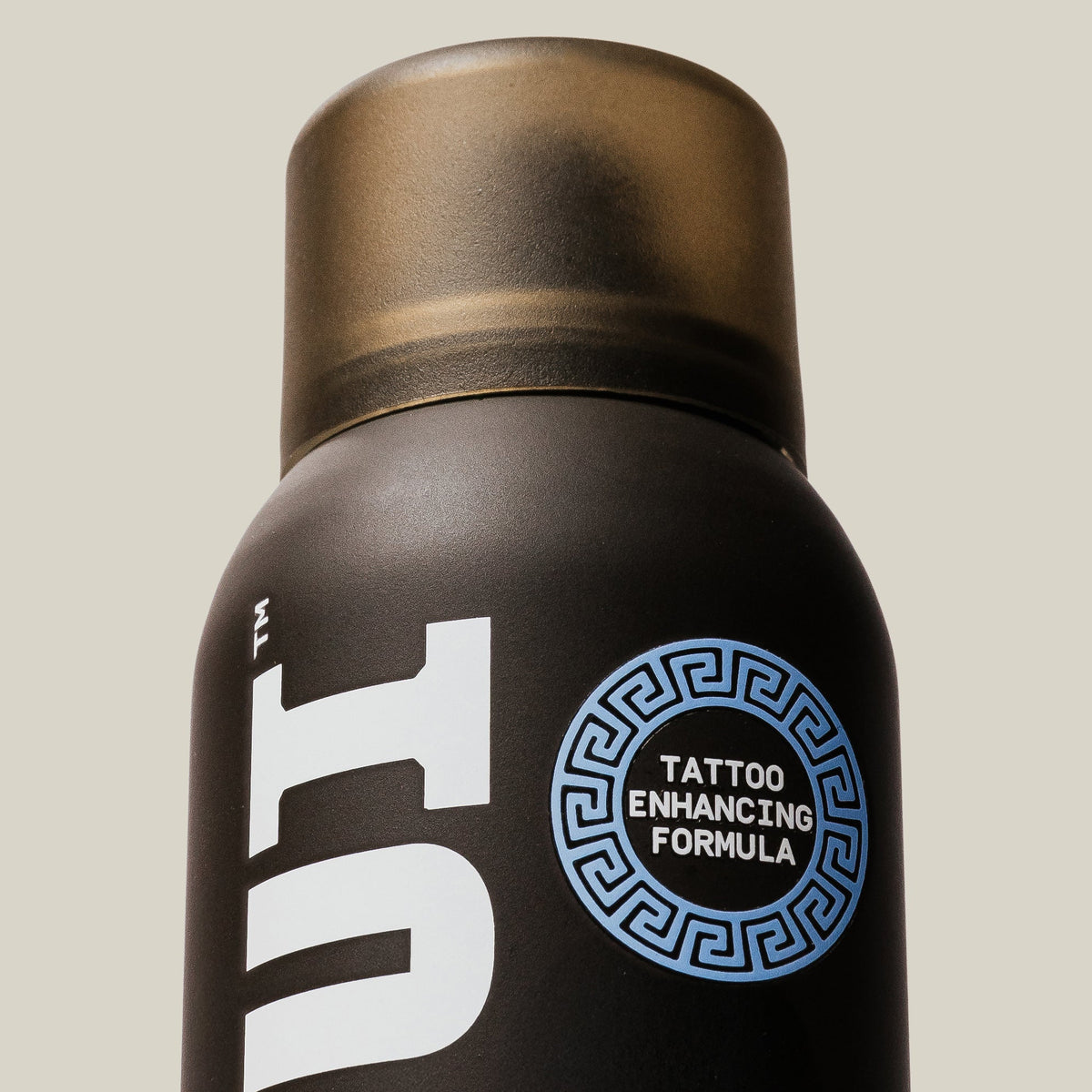 Close-up of PAPATUI Lush Coconut Tattoo Spray against a neutral background