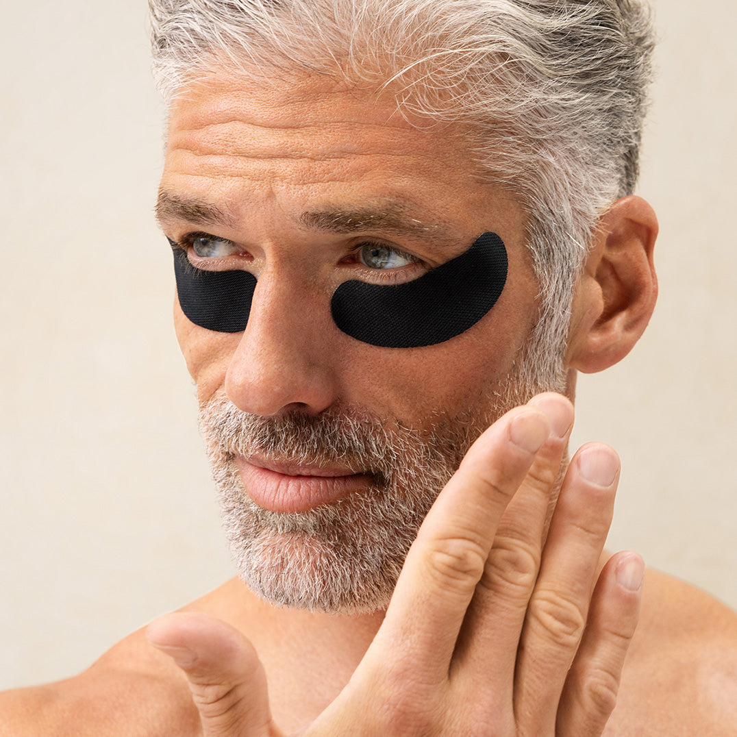 Man wearing PAPATUI Eye Patches against a neutral background