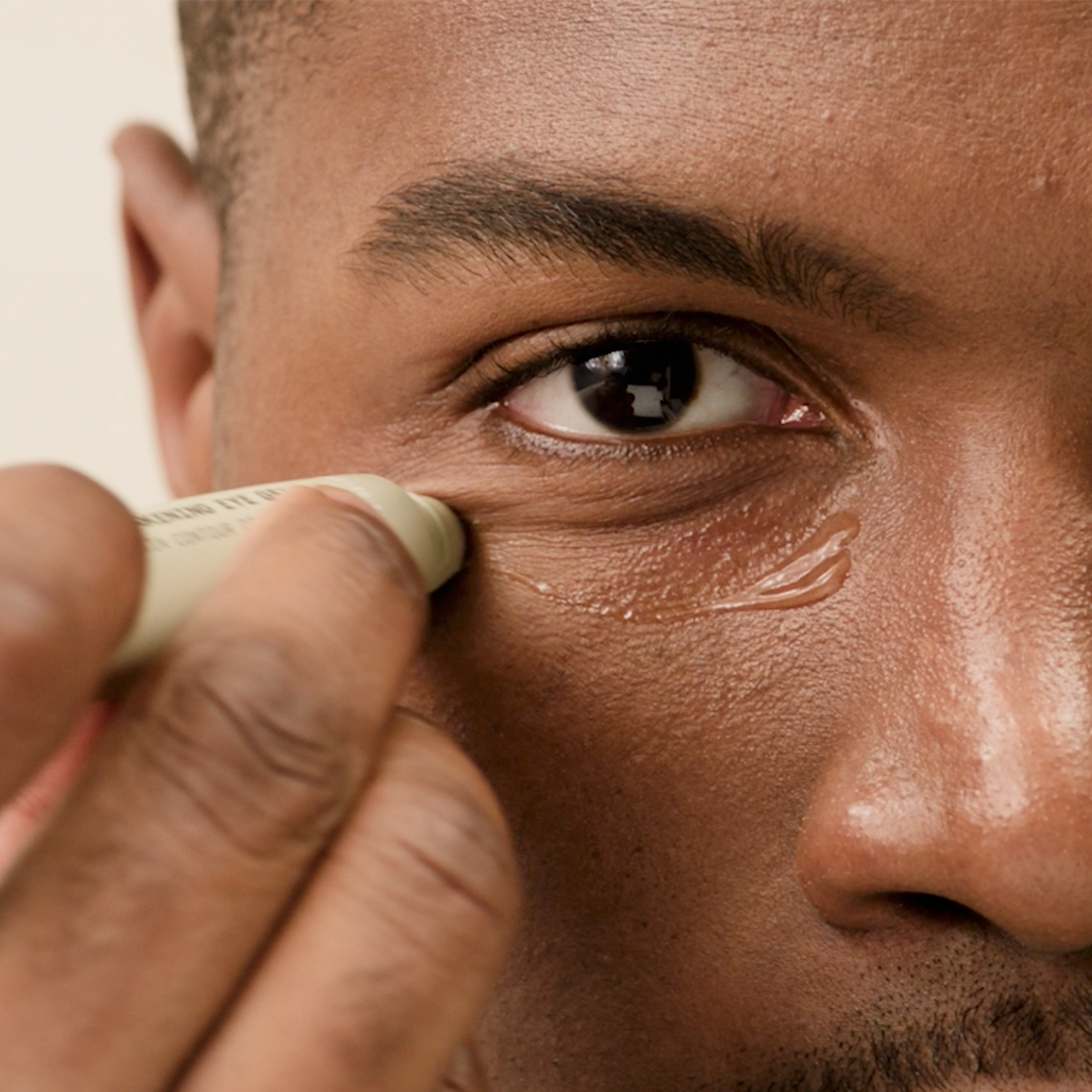 Person applying PAPATUI awakening eye gel to their under-eye