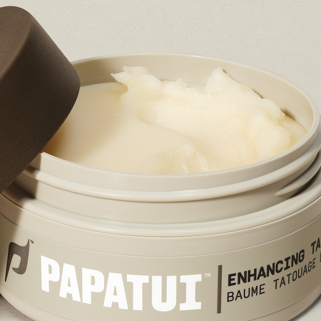 Open jar of PAPATUI Enhancing Tattoo Balm against a neutral background