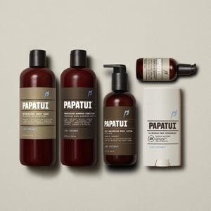 Papatui Body wash, shampoo and conditioner, deodorant in the scent lush coconut and unscented body lotion and facial moisturizer lined up on a beige background.