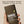 Papatui antiperspirant deodorant stick held in a hand with text on a beige background