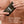 Person holding a Papatui antiperspirant stick with text highlighting features: blocks moisture, fights odor, and has a long lasting scent.