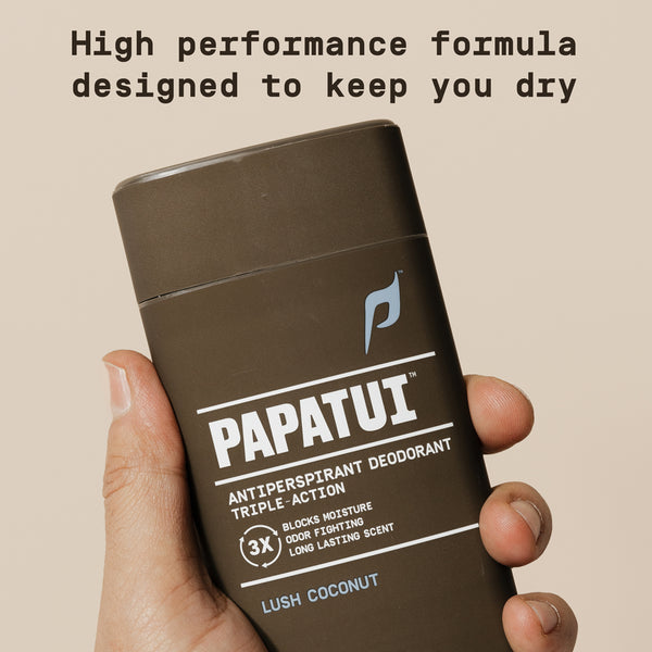 Papatui antiperspirant deodorant stick held in a hand with promotional text on a beige background