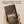 Papatui antiperspirant deodorant stick held in a hand with text on a beige background