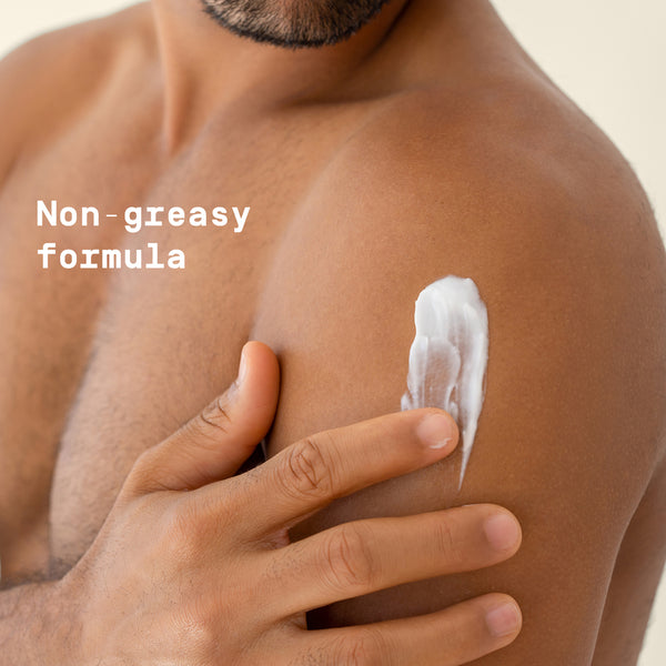 Man applying Papatui lotion to his arm with a text overlay saying 'Non-greasy formula'.