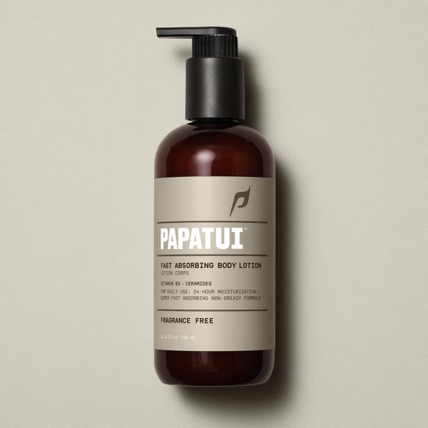 PAPATUI™ Unscented Fast Absorbing Body Lotion 11.5 fl oz Hydrating men's body lotion enriched with Vitamin B3 and ceramides for 24-hour moisturization. Designed for daily use with a super fast-absorbing, non-greasy formula. The image features a sleek amber bottle with a black pump dispenser, and a brown label with bold white typography displaying the PAPATUI™ logo. 