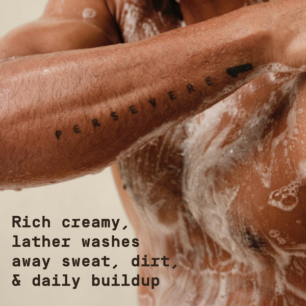 Body wash with bubbles on skin with "Rich creamy, lather washes away sweat, dirt, and daily buildup" text overlay - Papatui Body Wash