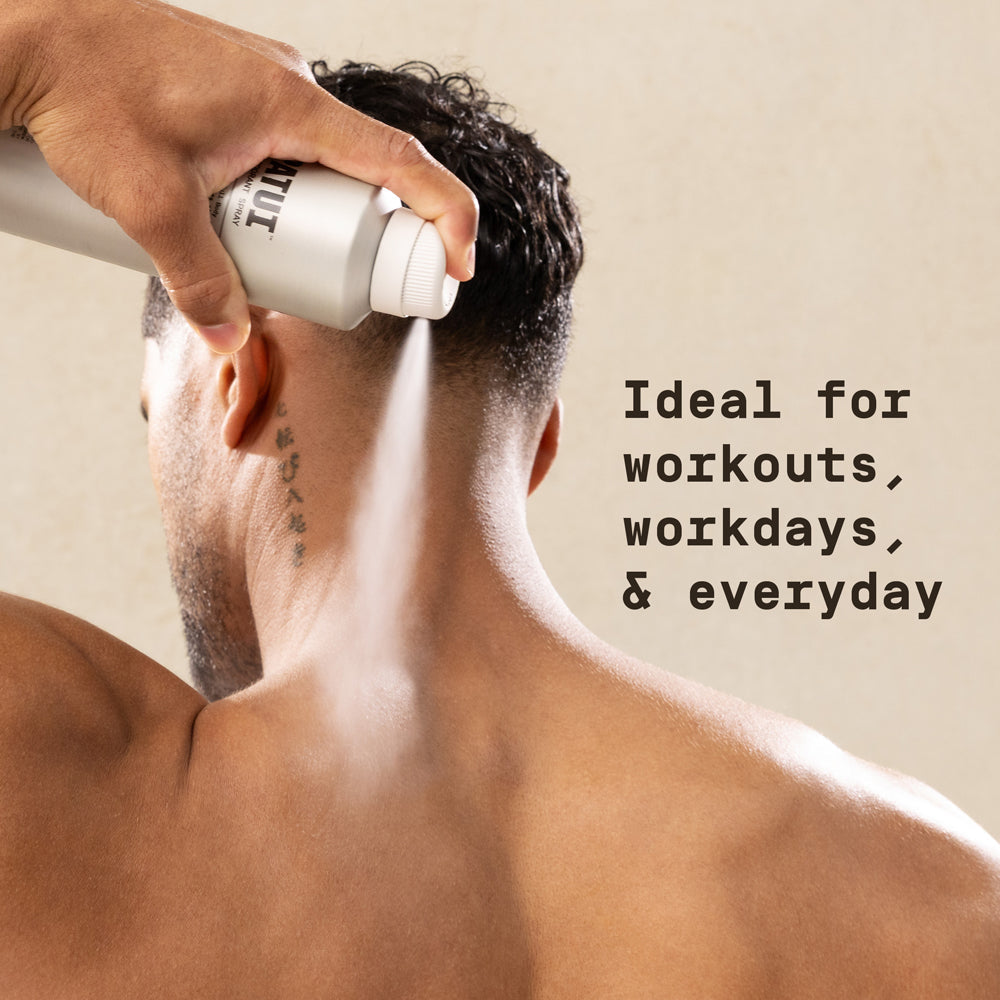Man spraying PAPATUI Full Body Deodorant Spray on back of his neck against a neutral background with text overlay reading "Ideal for workouts, workdays, & everyday"