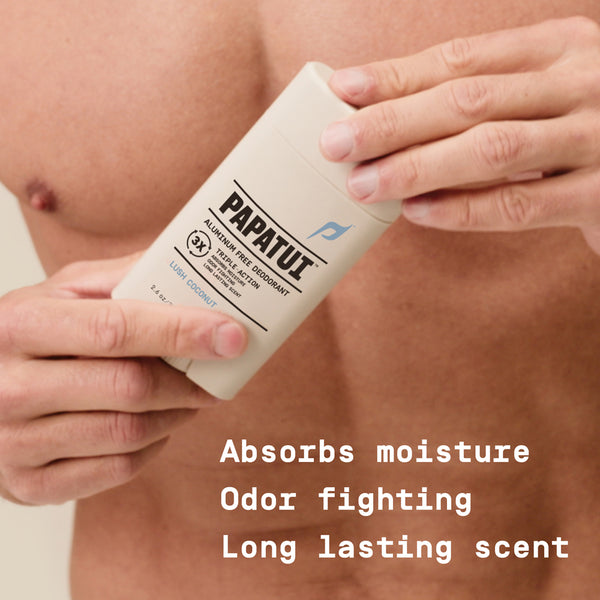 Person holding a Papatui deodorant stick with text highlighting features: absorbs moisture, fights odor, and has a long lasting scent.