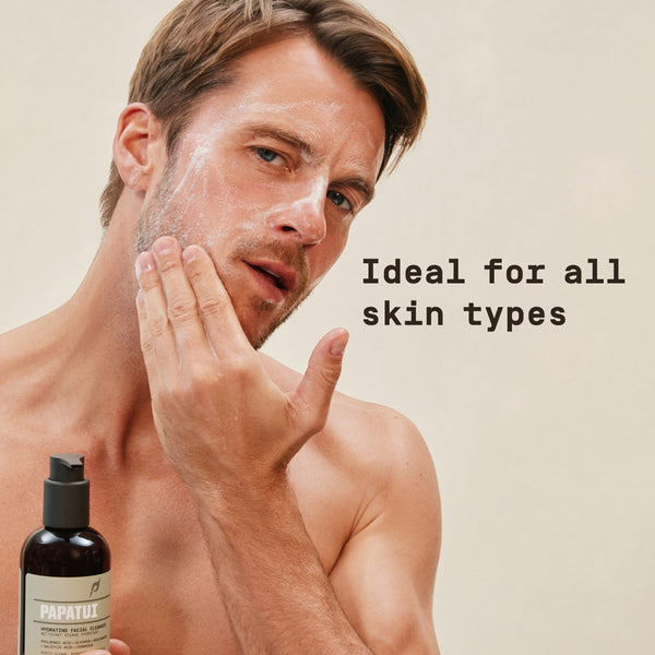 Man applying skincare product with a bottle of Papatui product in the corner on a beige background.
