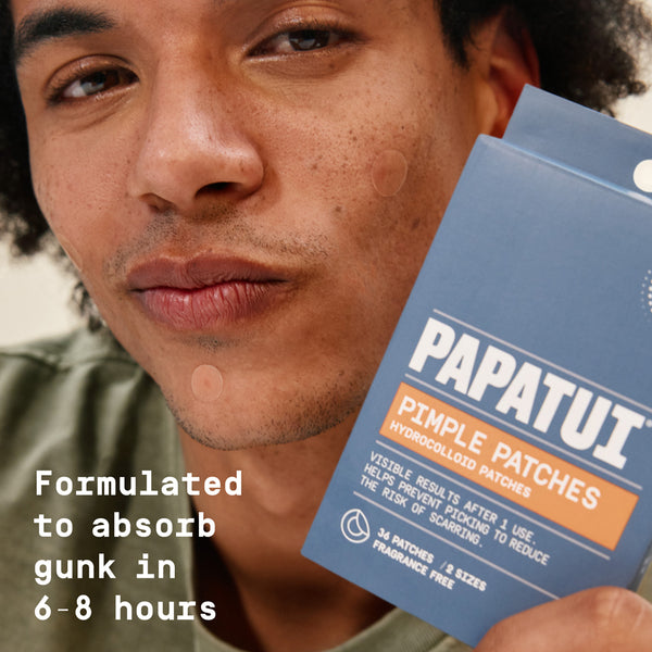 Man holding Papatui pimple patches with text about product benefits (formulated to absorb gunk in 6-8 hours).