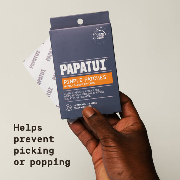 Papatui pimple patches packaging held by a hand with a neutral background