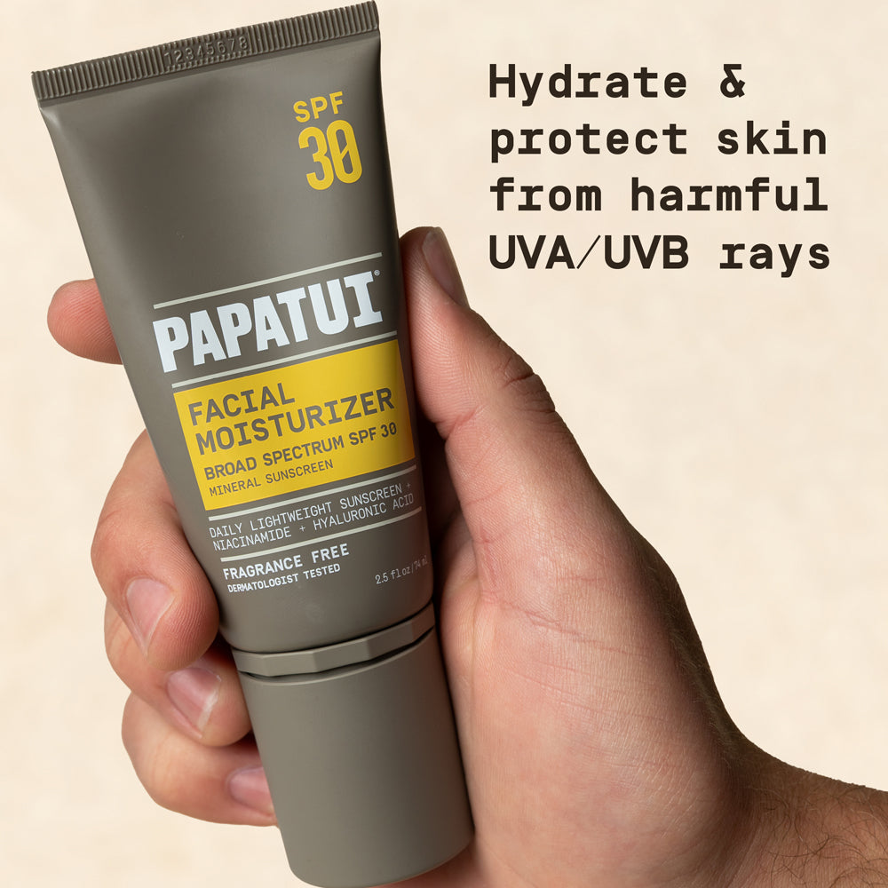 Hand holding PAPATUI Men’s Lightweight Facial Moisturizer with SPF 30 against a neutral background with text overlay that reads "Hydrate & protect skin from harmful UVA/UVB rays"