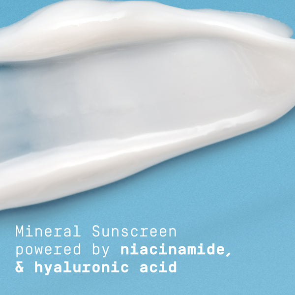 Papatui daily moisturizer SPF smear on a blue background with text about ingredients reading "mineral sunscreen powered by niacinamide, and hyaluronic acid."
