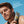 Man holding a tube of Papatui Men's daily moisturizer SPF with a blue background and Skin Cancer Foundation logo with text reading 