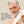 Man with gray hair and beard holding a towel, with text about hair care on a beige background - Papatui Shampoo and Conditioner