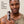 Man holding a can of Papatui Tattoo 360 Spray with text about 92% noticed more vibrant tattoos.
