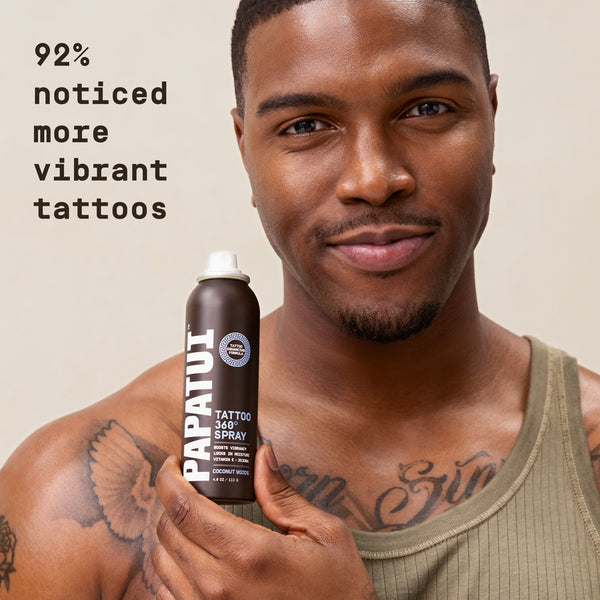 Man holding a can of Papatui Tattoo 360 Spray with text about 92% noticed more vibrant tattoos.