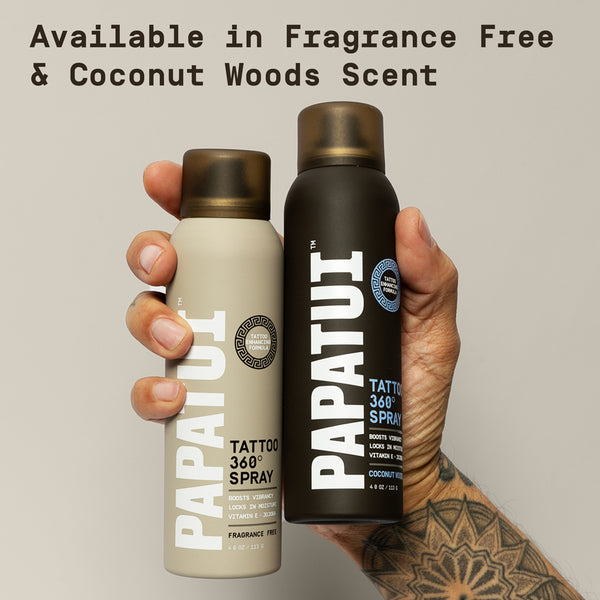 Two bottles of Papauti Tattoo 360 Spray - held by a hand with tattoos with text overlay saying 'Papatui Tattoo 360 Spray is available in fragrance free and coconut woods scent.