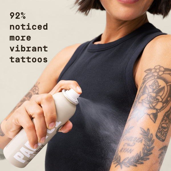 Man holding a can of Papatui Tattoo 360 Spray with text about 92% noticed more vibrant tattoos.