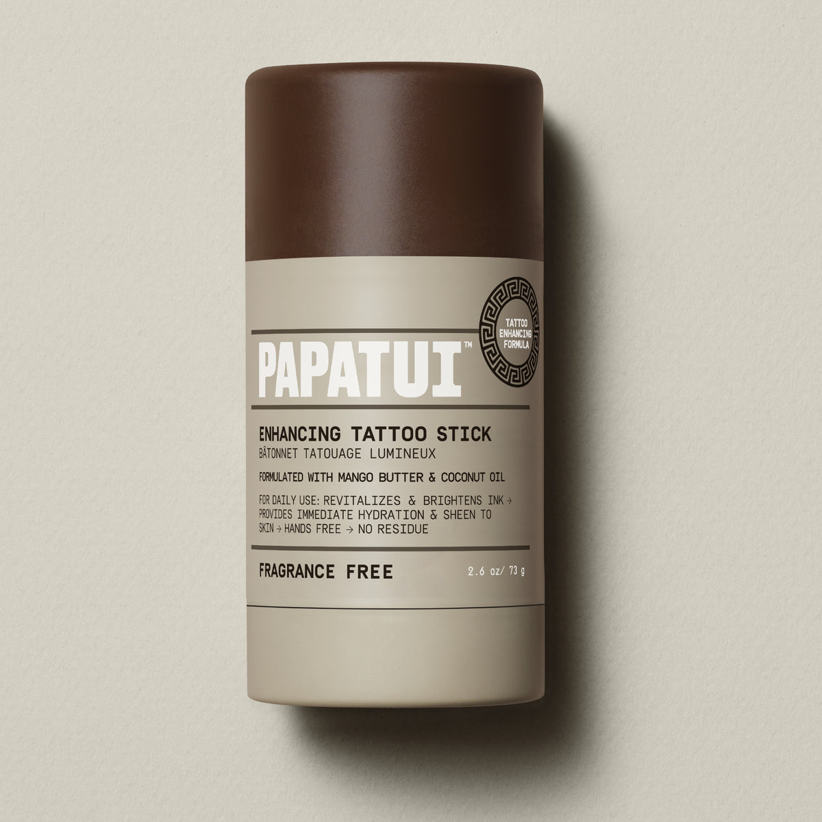 PAPATUI™ Enhancing Tattoo Stick (Fragrance-Free) 2.6 oz stick shown standing alone on a neutral beige backdrop. Fragrance-free formula helps revitalize and protect tattoos with mango butter and coconut oil.