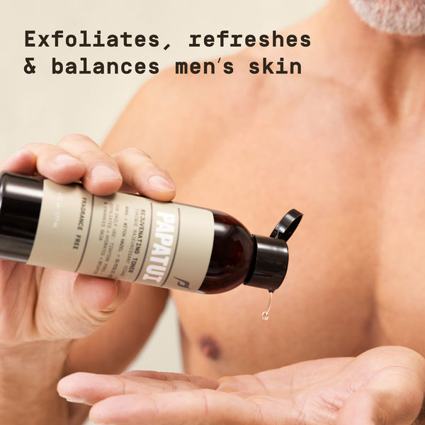 Person holding a Papatui Toner bottle with text about skin care benefits ("exfoliates, refreshes and balances men's skin)
