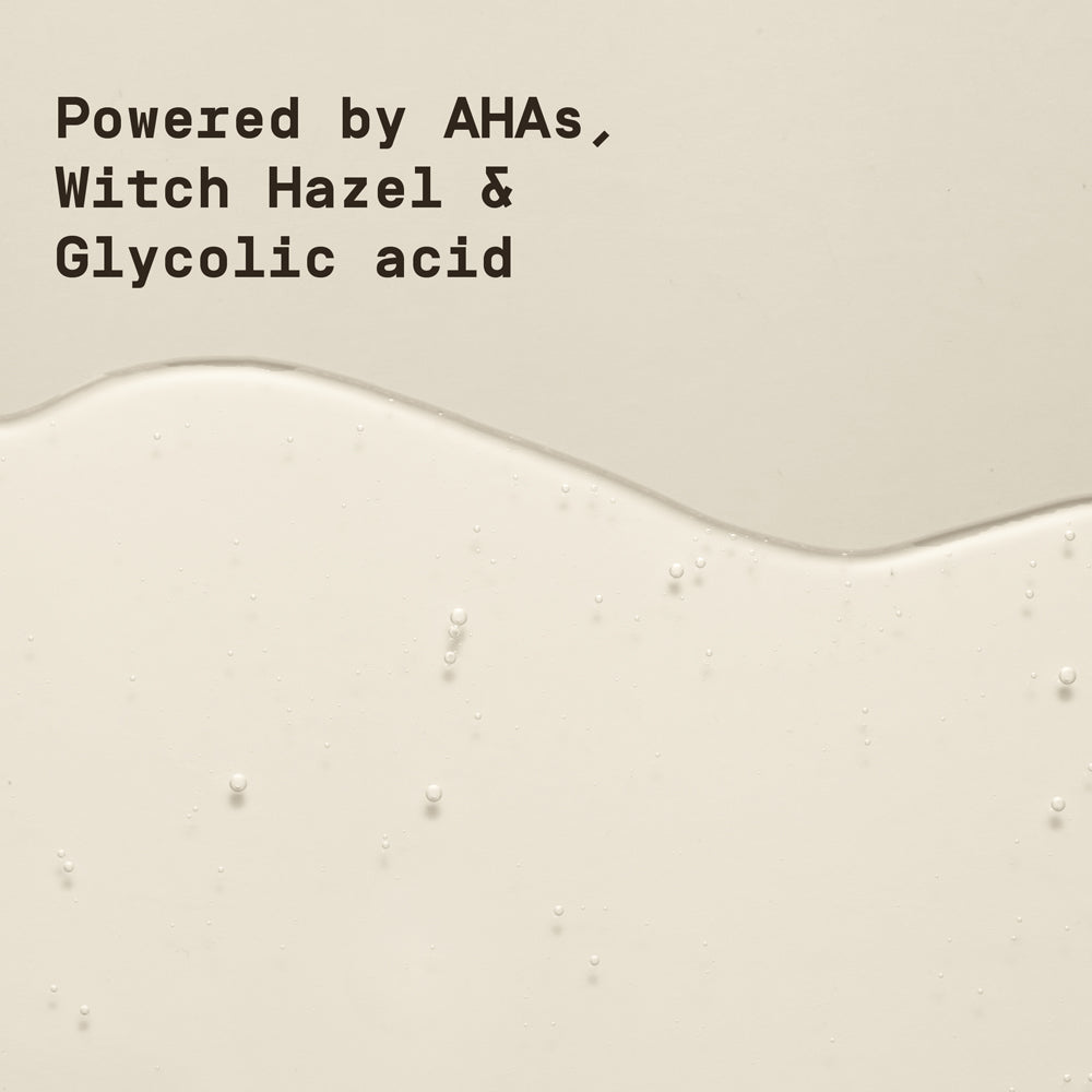 Text overlay on a beige background with a liquid toner on the surface, featuring ingredients like AHAs, Witch Hazel, and Glycolic acid.