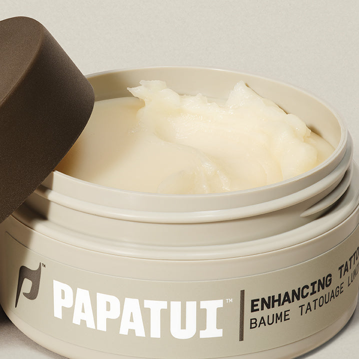 Open jar of PAPATUI Enhancing Tattoo against a neutral background