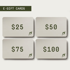 The image displays a selection of e-gift cards for Dwayne Johnson’s PAPATUI™ brand, shown on a digital screen. The design is minimalist, with a clean white background and four rectangular cards, each featuring a different monetary value: $25, $50, $75, and $100. Each card has the PAPATUI™ stylized “P” logo in the lower right corner. The heading “E-GIFT CARDS” is displayed in bold, dark text above the options.