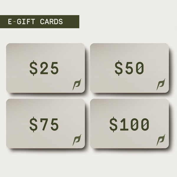 The image displays a selection of e-gift cards for Dwayne Johnson’s PAPATUI™ brand, shown on a digital screen. The design is minimalist, with a clean white background and four rectangular cards, each featuring a different monetary value: $25, $50, $75, and $100. Each card has the PAPATUI™ stylized “P” logo in the lower right corner. The heading “E-GIFT CARDS” is displayed in bold, dark text above the options.