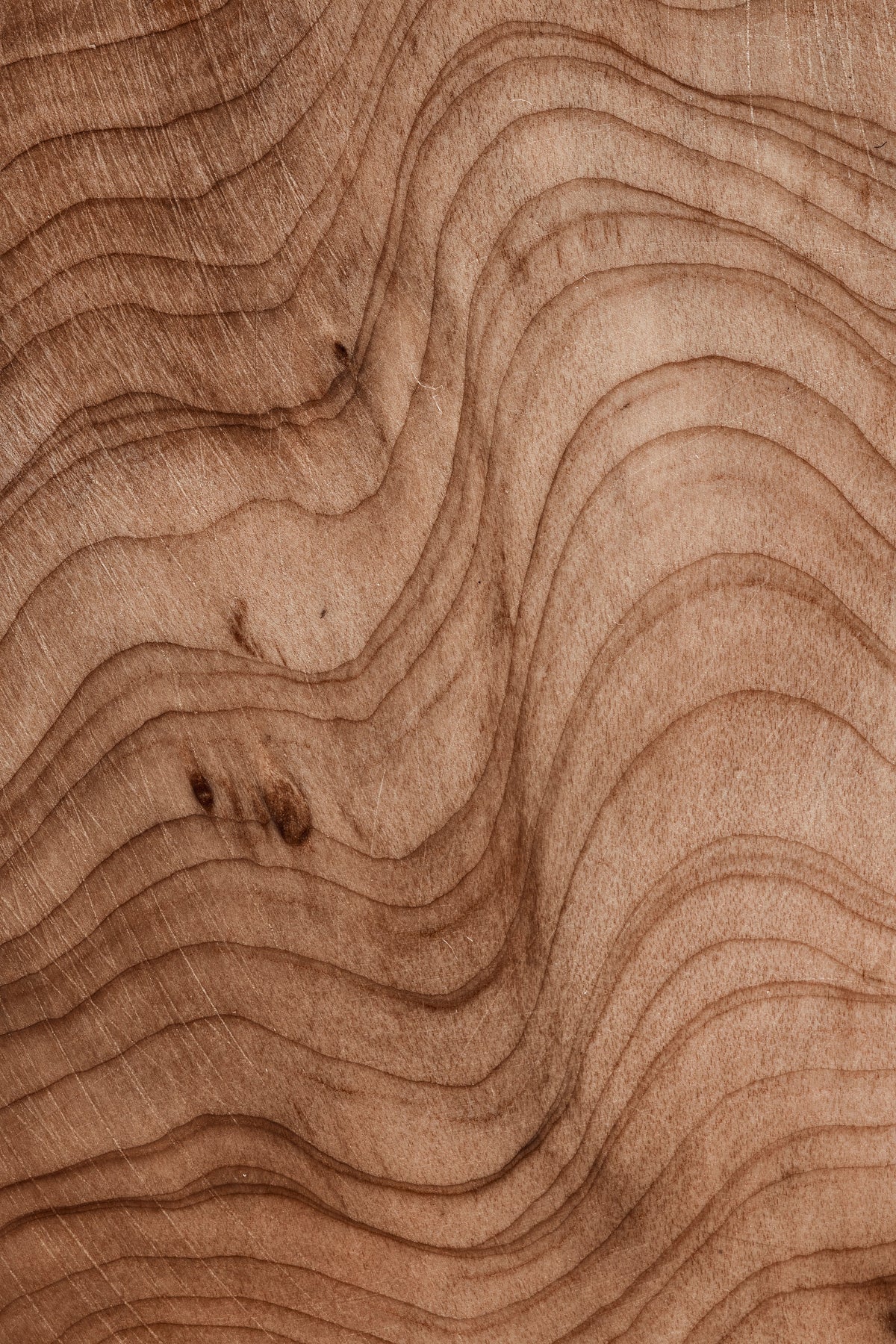 Close-up of wood grain texture with wavy lines