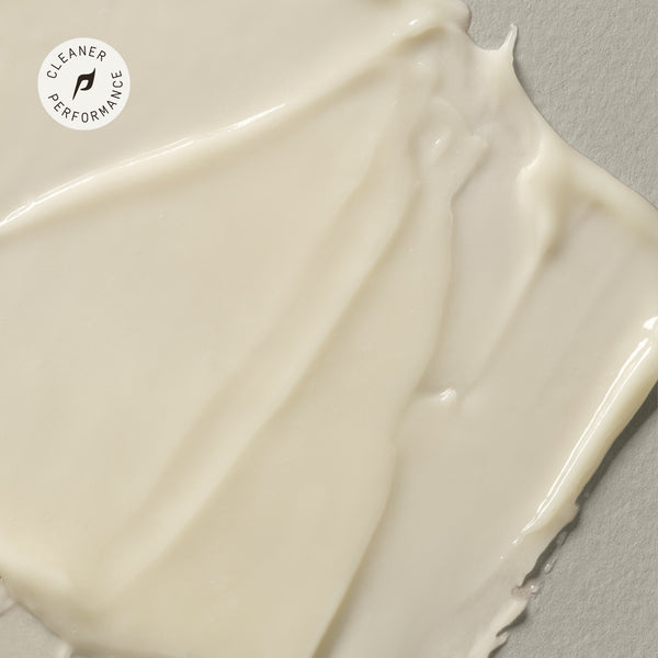 A texture shot of PAPATUI Enhancing Tattoo Balm against a beige background. 